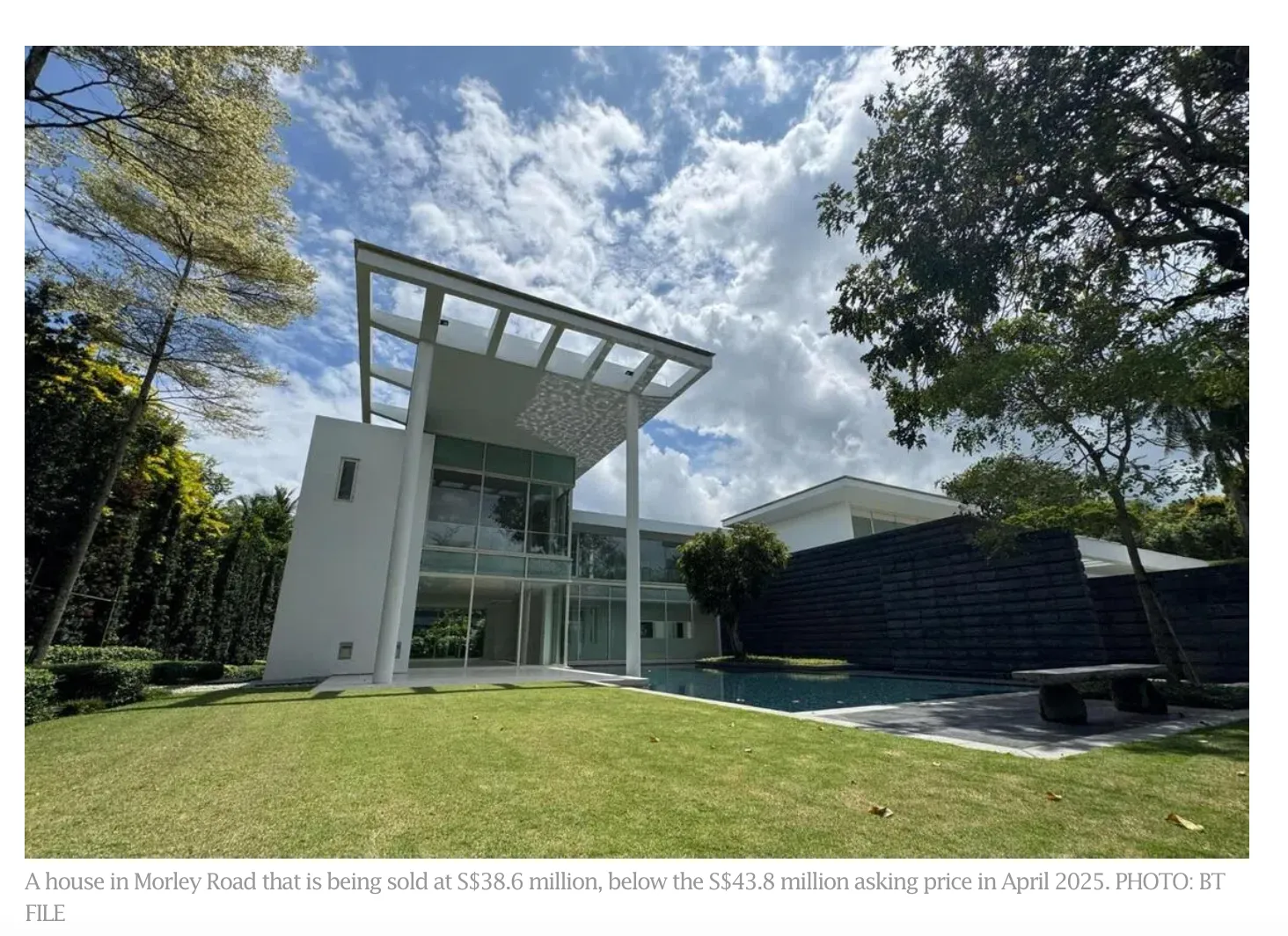 Modern white bungalow in Morley Road with a cantilevered roof, lawn and pool, sold for S$38.6 million