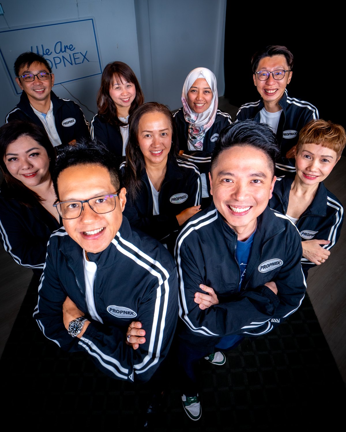 The Adrian Lim Properties team, photographed overhead in the studio